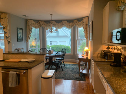 Kitchen with a dining area and large windows