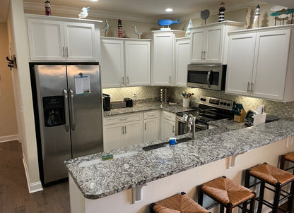 1301 Mariners - Large 4/3.5 End Unit with 2 Car Garage and Lake View*St. Simons, GA
