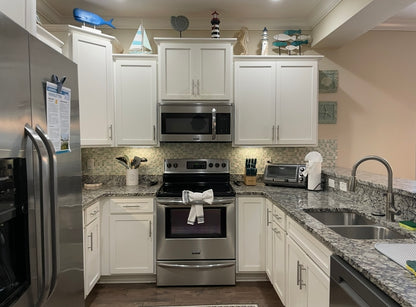 1301 Mariners - Large 4/3.5 End Unit with 2 Car Garage and Lake View*St. Simons, GA